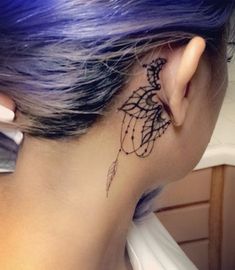 a woman with a tattoo on her neck