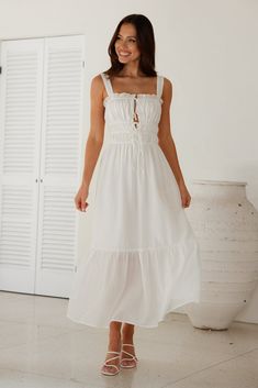 Length from shoulder to hem of size S: 129cm. Chest 39cm, Waist 33cm, across front only of size S. Midi dress. Lined, unlined hem. Model is a standard XS and is wearing size XS. True to size. Non-stretch. Elastic top/bodice. V-neck with ties. Flowy skirt. Slip on. Cold hand wash only. Tencel/Nylon/Polyester. For long summer days, style the Bondi Beach Midi Dress. Featuring a V-neck with ties, an elastic bodice and a flowy skirt. Style with sandals for a gorgeous daytime 'fit. White Beach Dresses, White Beach Dress, Beach White Dress, White Dress Outfit, Prom Shopping, Long White Dress, Flowy Skirt, White Midi Dress, Beach Dresses