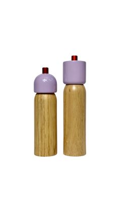 two wooden salt and pepper shakers on a white background