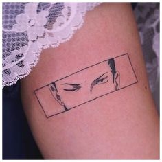 a woman's leg with a tattoo on it that has an image of two people