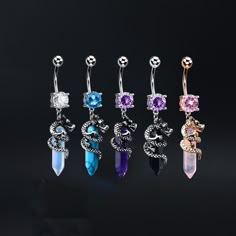 six pairs of dangling belly rings with different colored stones