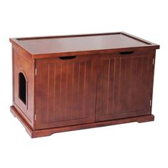 a large wooden dog house with two doors