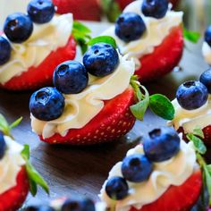 strawberries and blueberries are arranged on top of each other