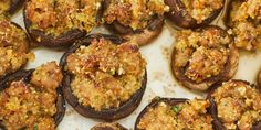 cooked stuffed mushrooms are sitting on a baking sheet