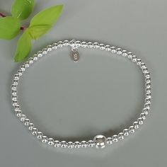 This is a sterling silver bracelet made with small beads. Diameter: 7.5 inches Beads: 2mm Big Bead: 5mm This bracelet is made of 925 hypoallergenic sterling silver. This piece is sent in a gift box. I can include a personal message from you if needed You are welcome to contact me at... bhavnakwintra1956@gmail.com For more beautiful pieces from my shop, please browse 👇 TOE RINGS: https://www.etsy.com/your/shops/TheSilverGame/tools/listings/section:27020628,view:table EAR HOOPS: https://www.etsy. Sterling Silver Bracelets With Silver Beads, Silver Sterling Bracelets With Round Beads, Dainty Silver Charm Bracelet With Round Beads, Everyday Sterling Silver Bracelet With Silver Beads, Sterling Silver Beads Charm Bracelet, Everyday Silver Charm Bracelet With Silver Beads, Minimalist Sterling Silver Bracelet With Silver Beads As Gift, Silver Sterling Silver Beaded Bracelets, Sterling Silver Bead Bracelet