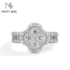 a white gold ring with diamonds on it and the words minty box written below