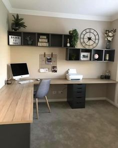 a home office with desk, computer and shelves