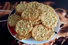 a white plate topped with cookies on top of a table