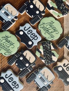 decorated cookies are sitting on a table with the words happy holidays spelled in black and green