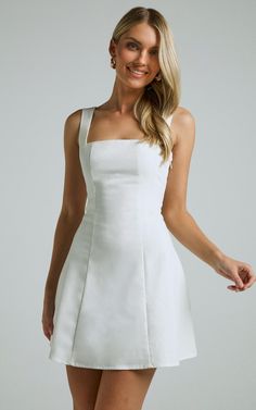 Get ready to turn heads in the Adiana Mini Dress - Square Neck Shirred Back A Line In Off White. This stunning white dress is perfect for any occasion, whether it's a casual day out or a special event. The square neck adds a modern and chic touch, while the shirred back provides comfort and support. Made from 100% cotton, this mini dress is lightweight and breathable, keeping you cool all day long. With its sleeveless design and flattering A-line silhouette, the Adiana Mini Dress will become you Short White Dress Summer, Graduation Dress Mid Size, Classy Mini Dress Chic, Classy Mini Dress Outfit, Senior Dinner Outfit, Classy White Mini Dress, White Mini Dress With Fitted Bodice And Straight Neckline, Classic White Mini Dress For Party, White Coat Ceremony Outfit Dresses