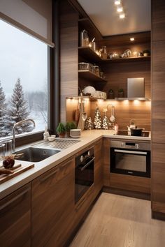 a kitchen with wooden cabinets and white counter tops next to a window overlooking the snow covered mountains