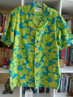 Men's 1960's Hawaiian Floral Print Shirt by Jantzen Kona Kai Hawaiian Casuals Unique Chartreuse and Turquoise Cotton Fabric 5 Front Gold Buttons (see photo) SIZE: Medium MEASUREMENTS (in inches): Shoulder to Shoulder (back): 18 Chest: 42 Side Length underarm to hem 19 Arm Length underarm to cuff 6 with 2 Inch Cuffs Neck Opening: 18 Neck to Hem (back): 30 INTERNATIONAL CUSTOMER?? Please email for Shipping Info Fitted Green Collared Camp Shirt, Vintage Green Hawaiian Shirt Relaxed Fit, Retro Green Camp Shirt For Spring, Fitted Green Shirt With Camp Collar, Retro Fitted Hawaiian Shirt For Spring, Vintage Green Collared Hawaiian Shirt, Fitted Retro Hawaiian Shirt For Vacation, Fitted Green Cotton Hawaiian Shirt, Fitted Green Hawaiian Shirt With Short Sleeves