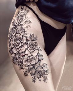 a woman's thigh with flowers on it