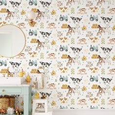 a bathroom wallpaper with animals on it and a mirror over the sink in front of it