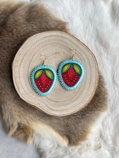 Their staple style the strawberry earrings are a must in any jewellery collection. These are handmade by local Indigenous artist Keegan W. beaded with size 11 seed beads, 18k gold hooks and backed with hide. They are 2” in width and 3” in length. The ones with the mink drop down to 4” in length total. Strawberry Earrings, Gold Hooks, Book Stationery, Day Planners, Scarf Jewelry, Colouring Books, Journal Stickers, Jewellery Collection