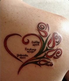 the back of a woman's shoulder with a tattoo on it