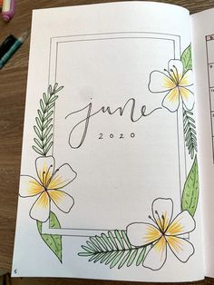 an open planner with flowers on it and the date june written in cursive writing