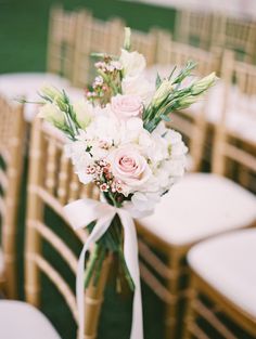 a bouquet of flowers sitting on top of a chair