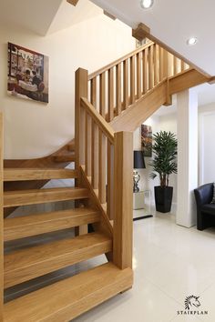 a living room filled with furniture and a stair case