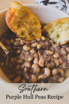 a white bowl filled with beans and bread