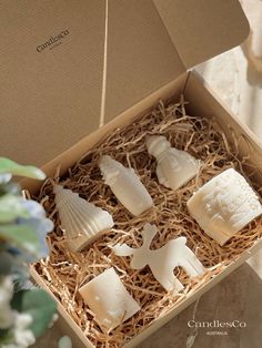 four pieces of soap in a box on a table