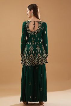 Bottle green padded peplum kurta with cutdana, sequin, thread, dabka, pearl embroidery in floral pattern and scallop border. Paired with tiered pleated sharara and dupatta. - Aza Fashions Green Peplum Sharara For Eid, Green Peplum Sharara For Designer Wear, Traditional Green Sharara With Peplum, Formal Green Sharara With Intricate Embroidery, Unstitched Embellished Green Sharara, Festive Green Peplum Sharara, Semi-stitched Green Sharara With Cutdana, Green Hand Embellished Semi-stitched Sharara, Semi-stitched Green Sharara With Cutdana Details