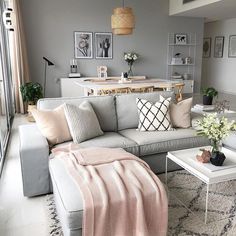 a living room filled with lots of furniture and decor