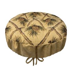 a round cushion with pine trees on the front and bottom, tied to a cord