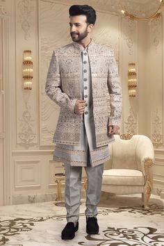 This Mens Sherwani features delicate thread work with sequin embellishments, elevating this traditional piece to a new level of luxury. The open jacket style offers a modern twist, making it a versatile and stylish option for any formal occasion. Experience the perfect blend of tradition and contemporary design with this elegant sherwani. Engagement Dress Men, Elegant Festive Outerwear With Dabka Work, Elegant Outerwear With Dabka, Designer Sherwani With Intricate Embroidery For Winter, Elegant Designer Outerwear For Eid, Designer Winter Sherwani With Intricate Embroidery, Designer Sherwani For Reception In Winter, Elegant Outerwear With Zari Work For Eid, Elegant Sherwani With Chikankari Embroidery For Winter