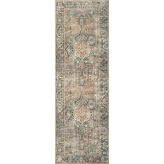 an antique rug with blue, beige and green colors on the bottom half of it