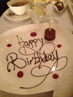 a happy birthday cake on a white plate