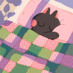 a black cat sleeping on top of a blanket