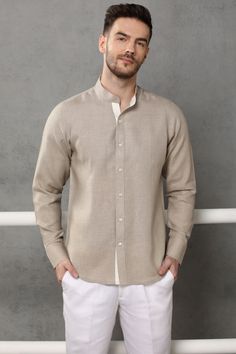 Carry a stunning look in this traditional Nehru collar shirt which is Â homespun in fine quality linen. The  shirt highlights a color block shirt-placket in soft blue color. Classic Long Sleeve Flax Tops, Classic Flax Shirt With Spread Collar, Flax Classic Shirt With Spread Collar, Beige Long Sleeve Linen Shirt, Classic Collared Shirt In Flax Color, Classic Shirt With Relaxed Fit And Stand Collar, Long Sleeve Cotton Shirt In Flax Color, Long Sleeve Flax Cotton Shirt, Relaxed Fit Linen Shirt With Collar