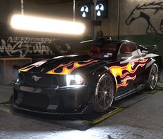 a car with flames painted on it in a parking garage, next to some graffiti