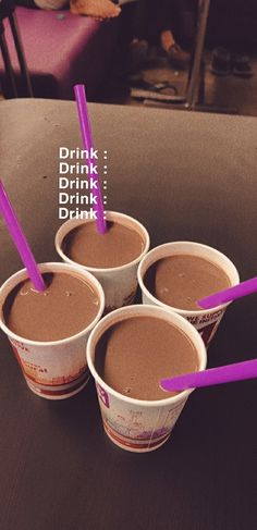 four cups with different types of drinks in them