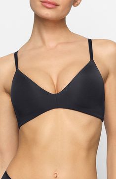 This wireless bra with lightly lined, cloud-like molded foam pads provides an ultracomfortable fit. This supportive foundation piece is ideal for everyday wear and perfectly shapes and contours the bust for a smooth look. It also features fully adjustable straps and wide wings. Lined 84% polyamide, 16% spandex Hand wash, dry flat Imported Modern Sports Bra With Medium Support, Modern Seamless Bra, Low-cut Bra With Built-in Support, Scoop Neck Bra With Built-in Support, Modern Sports Bra With Medium Support, Bra Friendly, Black Soft Touch No-show Bra, Black No-show Soft Touch Bra, Black Low-cut Sports Bra With Removable Pads, Black No-show Soft-touch Bra