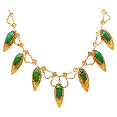 Egyptian-Etruscan revival scarab beetles festoon necklace This is a gorgeous festoon dangle-drop necklace, created in England during the Victorian period, back in the 1870. The fabulous necklace was carefully crafted in the desirable Egyptian-Etruscan revival style in yellow gold of 18 and 19 karats and embellished with seven genuine vivid green scarab beetles with beautiful metallic iridescence. The necklace is fitted with a concealed security boxed lock and have a great eye appeal when is wear.. Jewelry with genuine beetles are very rare to see and truly remarkable and whimsical pieces. They are highly desired and very collectible. Revival jewelry The styles from the renaissance and middle ages, begun in the 1850’s, The Renaissance and Egyptian revivals were joined by a classical revival Festoon Necklace, Antique Necklaces, Scarab Beetle, Victorian Period, Iridescent Green, Antique Necklace, Ancient Cultures, Weird And Wonderful, Beetles