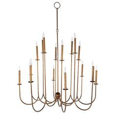 a large brass chandelier with many candles hanging from it's center point