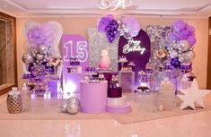 a birthday party with purple and silver decorations