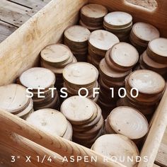 a wooden box filled with lots of wood discs