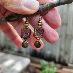 Love these simple Boho earrings with transparent honey colored Czech glass "tiles".  A stack of brown Czech glass Rondelles and brass beads accents the square beads.  I've paired the tile squares with antique brass lentil dangles (same front and back).  A simple yet gorgeous design, they move when you walk:) Lightweight.  Just under 1 3/4 inches in length including the antique brass ear wire hooks.. A great look for jeans or for more dressy attire.  A celebration of life! Handmade. One of a kind Nickel-free Brown Czech Glass Earrings, Nickel-free Brown Earrings With Czech Glass, Nickel Free Brown Earrings With Czech Glass, Shabby Chic Earrings, Petite Earrings, Unique Handmade Earrings, Casual Earrings, Bronze Jewelry, Chic Earrings