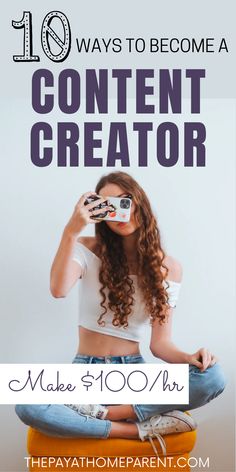 a woman sitting on top of a chair holding a camera and looking through the lens