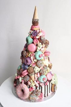 a cake decorated with donuts and sprinkles