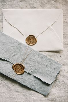 an envelope with two coins attached to it