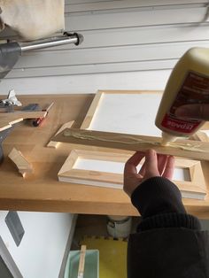 a person is working with wood and glue