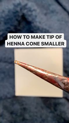 a close up of a toothbrush with the words how to make tip of henna cone smaller