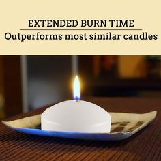 a white candle sitting on top of a blue plate with the words extended burn time outperforms most similar candles