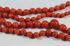 -Antique 10k Gold Hand Knot Orange Red Coral Necklace -Total length: 19.75 in -Biggest bead size: 7.85 mm -Smallest bead size: 3.5 mm -Total weight: 15 g -Tested 10k gold -Beads are not perfectly round Classic Red Jewelry With Round Beads, Red Round Beads For Formal Occasions, Classic Red Jewelry With Polished Beads, Classic Red Round Beaded Necklaces, Classic Red Hand-strung Jewelry, Classic Red Necklace With Polished Beads, Formal Red Round Beads, Classic Red Hand-strung Necklaces, Orange Single Strand Red Coral Jewelry