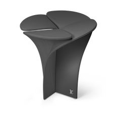 the curved table is made from black plastic