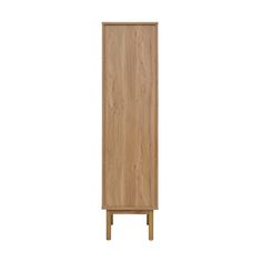 a tall wooden cabinet sitting on top of a white wall